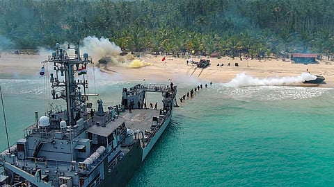 Armed forces personnel take part in an amphibious landing drill during the tri-service exercise 'Dweep Shakti'. 