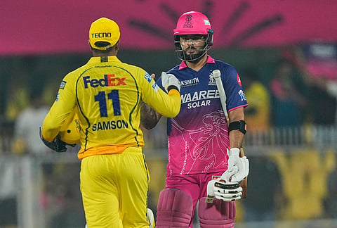 Rajasthan Royals' captain Riyan Parag, right, shake hands with Chennai Super Kings' Sanju Samson after winning the Indian Premier League cricket match against Chennai Super Kings in Guwahati.