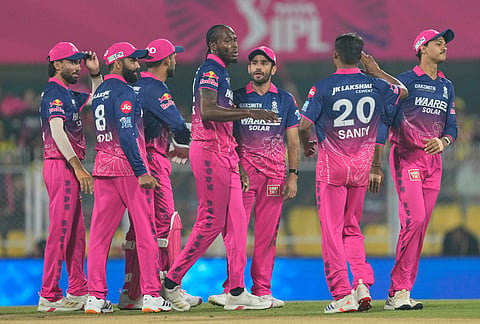 Rajasthan Royals' Jofra Archer, center without cap, celebrates with teammates the wicket of Chennai Super Kings' captain Ruturaj Gaikwad during the Indian Premier League cricket match between Chennai Super Kings and Rajasthan Royals in Guwahati.