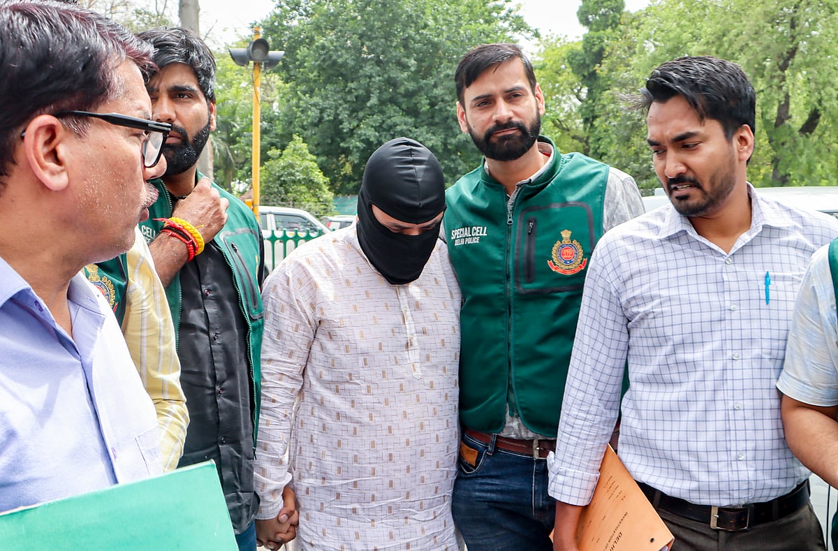Delhi Police Special Cell personnel produce Shabir Ahmad Lone, an accused linked to Lashkar-e-Taiba (LeT) and alleged to be part of a module involved in defacing Delhi Metro station walls and planning further activities, at Patiala House Court, in New Delhi, Monday, March 30, 2026.  - PTI