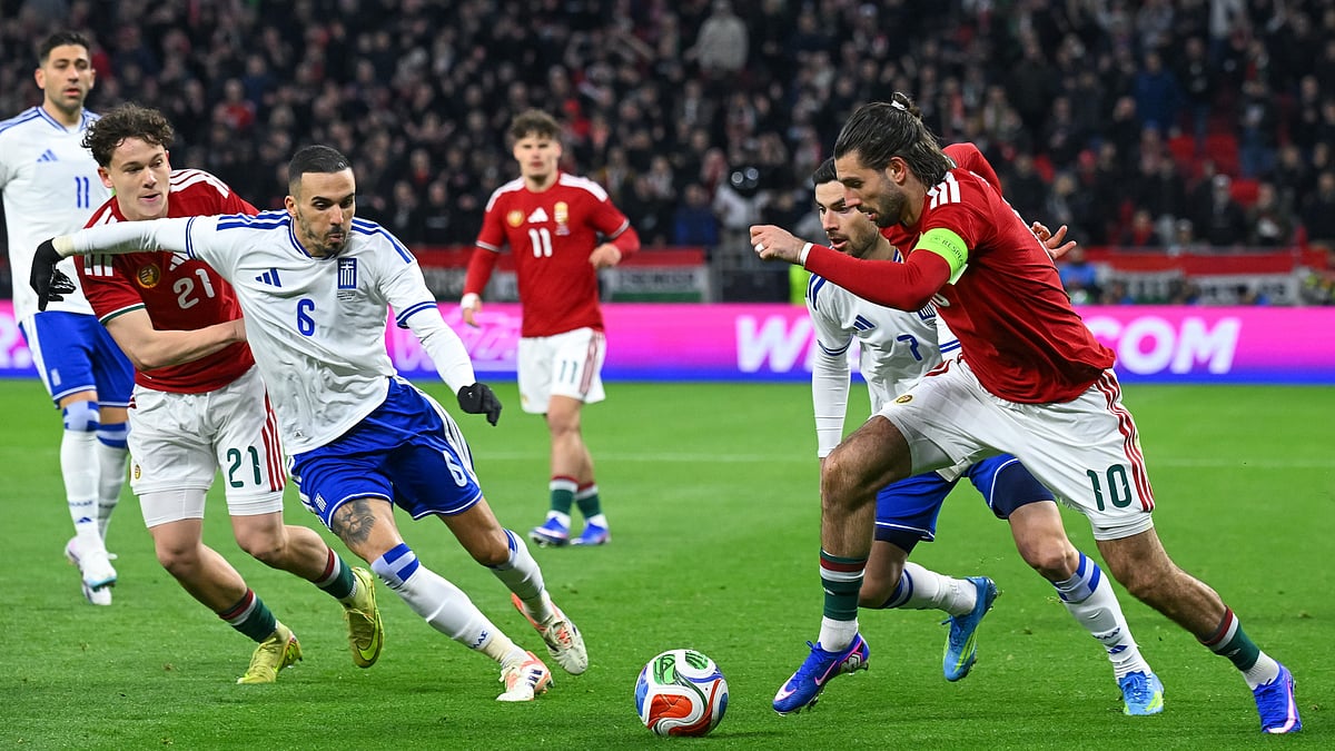 Dominik Szoboszlai, right, of Hungary and Giorgos Masouras, second right, of Greece fight for the ball during the soccer friendly match. - Tamas Purger/MTI via AP