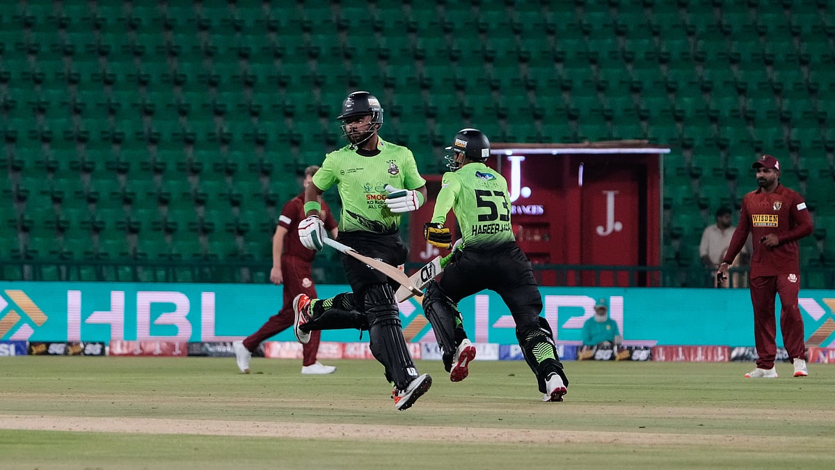 Lahore Qalandars' Fakhar Zaman, second left, and Haseeb Ullah, second right, run between the wickets during the opening cricket match of the Pakistan Super League between Lahore Qalandars and Hyderabad Kingsmen, which taking place without spectators, in Lahore, Pakistan, Thursday, March 26, 2026. - | Photo: APK.M. Chaudary