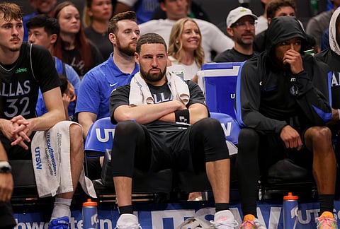 Dallas Mavericks guard Klay Thompson (31) sits on the bench in the second half of an NBA basketball game against the Minnesota Timberwolves in Dallas. 