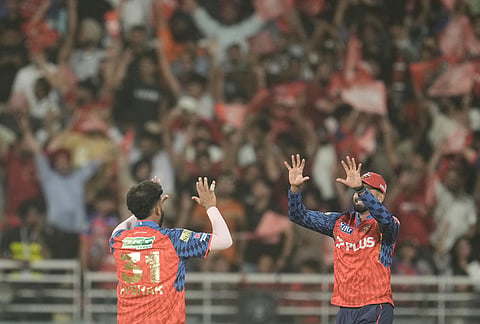 Punjab Kings' Vijaykumar Vyshak celebrates with captain Shreyas Iyer, right, the wicket of Gujarat Titans' Glenn Phillips during the Indian Premier League cricket match between Gujarat Titans and Punjab Kings in New Chandigarh.