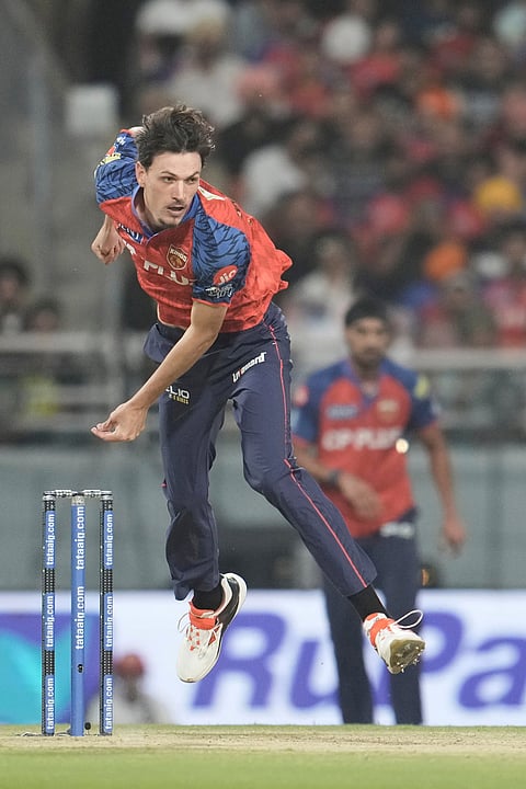 Punjab Kings' Marco Jansen bowls a delivery during the Indian Premier League cricket match between Gujarat Titans and Punjab Kings in New Chandigarh.