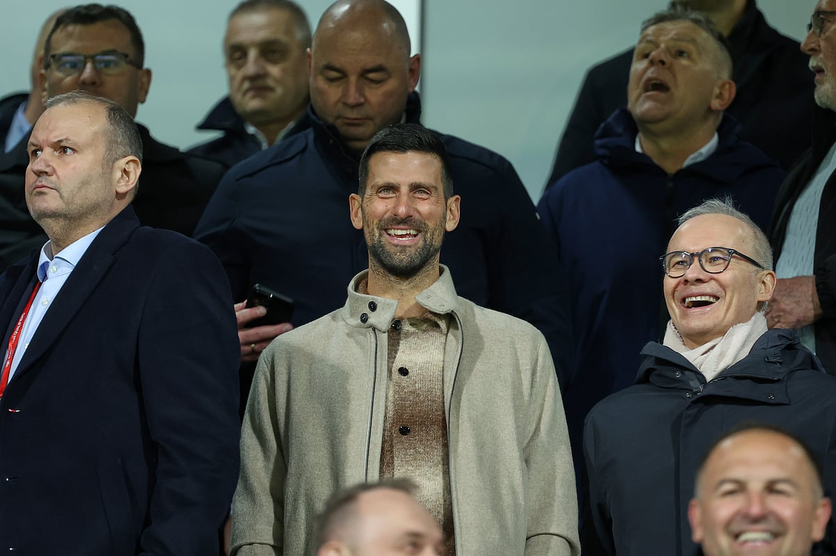 Tennis star Novak Djokovic in the stands as he watches the BIH vs ITA game.