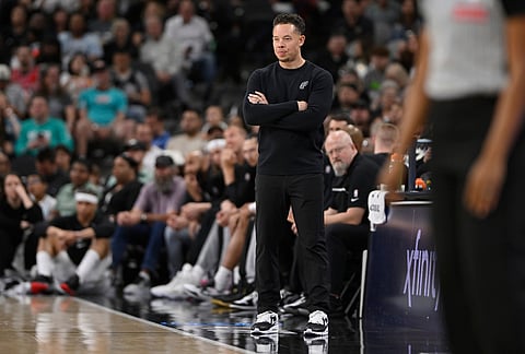 San Antonio Spurs head coach Mitch Johnson watches the play during the first half of an NBA basketball game against the Chicago Bulls in San Antonio. 