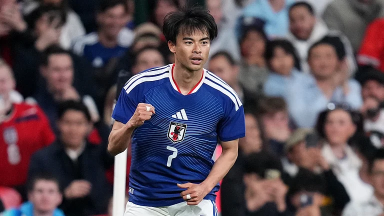 Japan's Kaoru Mitoma celebrates after scoring his side's first goal during the International friendly soccer match between England and Japan in London, Tuesday, March 31, 2026 .
- AP Photo/Kirsty Wigglesworth