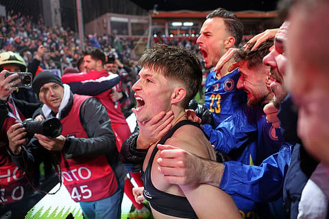 Bosnia's Esmir Bajraktarevic celebrates after winning a penalty shootout during the World Cup qualifying playoff final soccer match between Bosnia and Italy in Zenica
