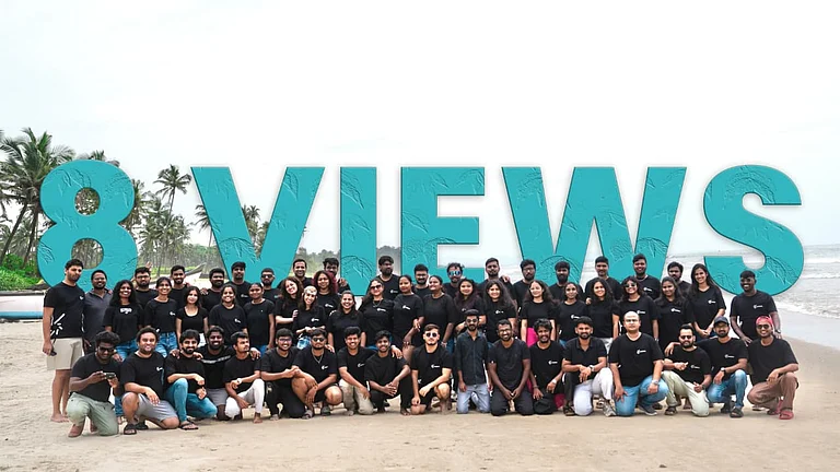 Large group on a beach behind "8 VIEWS" text - null