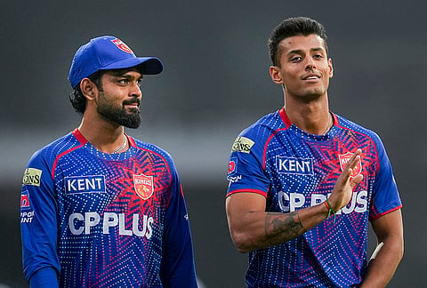 Punjab Kings' Pyla Avinash, left, and Suryansh Shedge warm up before an Indian Premier League (IPL) 2026 T20 cricket match between Punjab Kings and Gujarat Titans, in Mullanpur.