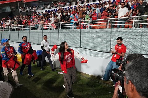 Punjab Kings' co-owner Preity Zinta throw jersey to the stands during the Indian Premier League cricket match between Gujarat Titans and Punjab Kings in New Chandigarh, India, Tuesday, March 31, 2026.