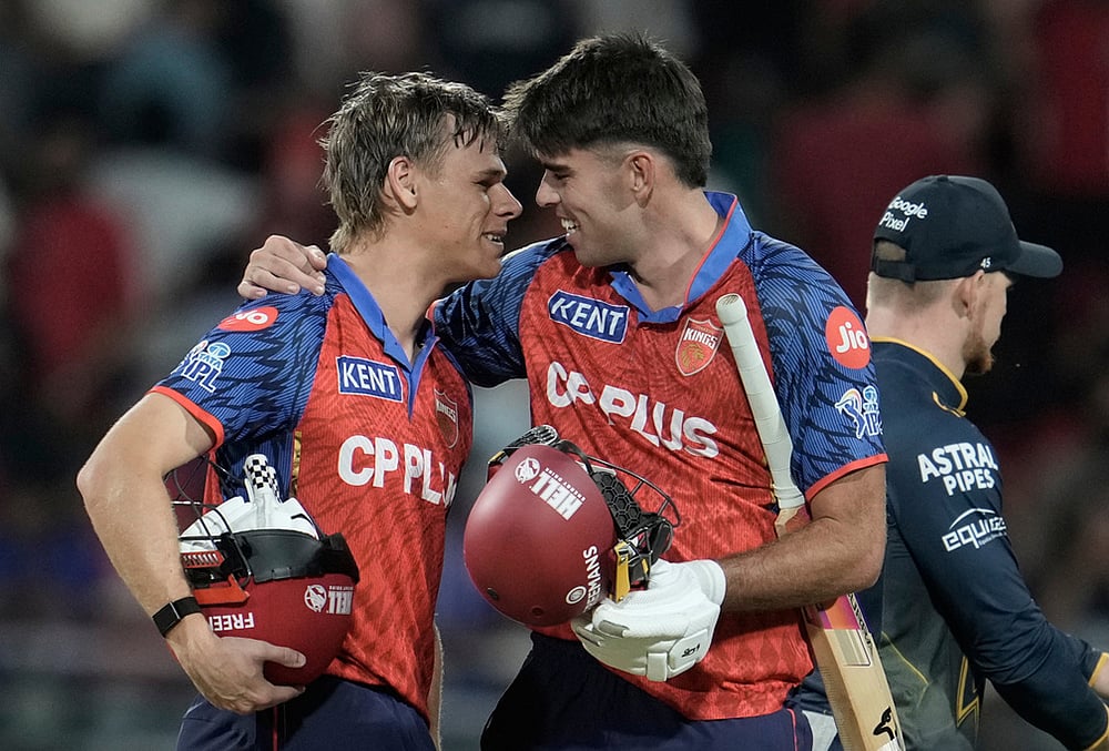 | Photo: AP/Ashwini Bhatia : Punjab Kings' Cooper Connolly, left, and Xavier Bartlett celebrates the win against Gujarat Titans during the Indian Premier League cricket match in New Chandigarh.