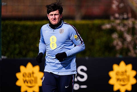 England's Harry Maguire exercises during a training session in London.