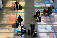 Overseas Travel Spending By Indians Falls To $1.09 Billion In March Amid West Asia Crisis | Photo: AP/Seth Wenig : Popular transit hubs like Dubai and Doha faced severe operational restrictions, directly impacting Indian travellers who frequently use these routes for onward journeys to Europe and the US.