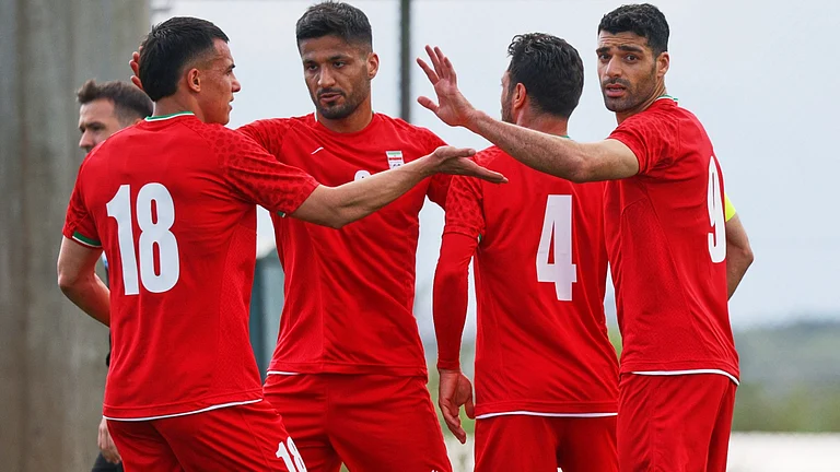 Iran's Mehdi Taremi, right, celebrates with teammates after scoring their side's second goal during a friendly soccer match between Iran and Costa Rica, in Antalya, southern Turkey, Tuesday, March 31, 2026 - (AP Photo/Riza Ozel)