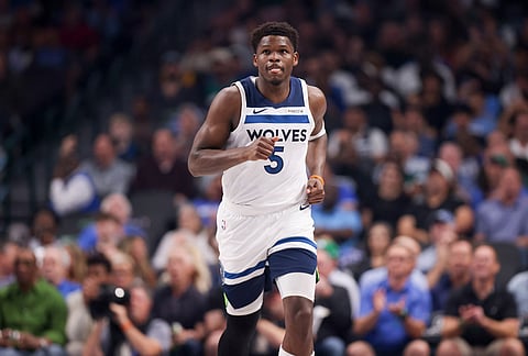 Minnesota Timberwolves guard Anthony Edwards runs the court before an NBA basketball game against the Dallas Mavericks, in Dallas.