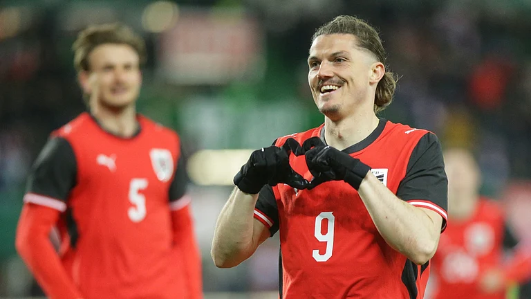 Austria's Marcel Sabitzer celebrates after scoring his side's opening goal during the international friendly soccer match between Austria and South Korea in Vienna, Austria, Tuesday, March 31, 2026. - AP Photo/Heinz-Peter Bader
