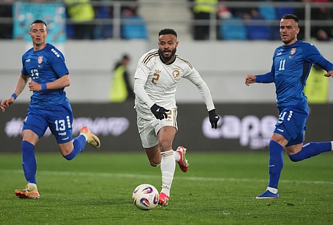 Saudi Arabia's Ali Majrash, centre, challenges for the ball with Serbia's Stefan Bukinac, left, and Filip Kostic during the international friendly soccer match between Serbia and Saudi Arabia in Backa Topola, Serbia.