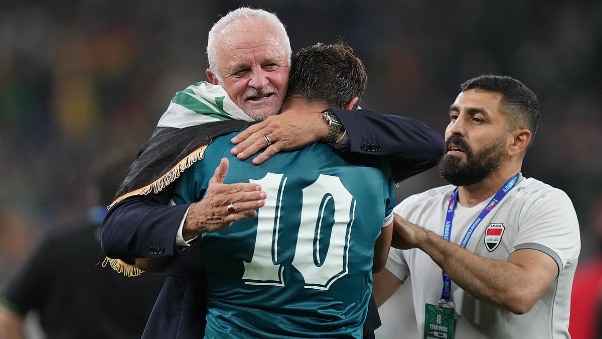 Iraq's coach Graham Arnold, left, and Mohanad Ali (10) celebrate at the end of the World Cup playoff final soccer match between Iraq and Bolivia in Monterrey, Mexico, Tuesday, March 31, 2026 - (AP Photo/Fernando Llano)