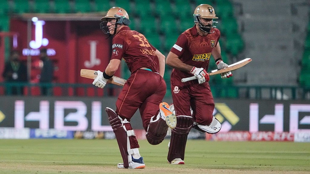 AP : Marnus Labuschagne, left, and Irfan Niazi bat during the opening match of the Pakistan Super League between Lahore Qalandars and Hyderabad Kingsmen in Lahore