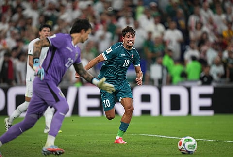 Iraq's Mohanad Ali, center, tries to reach the ball during the World Cup playoff final soccer match between Iraq and Bolivia in Monterrey, Mexico.