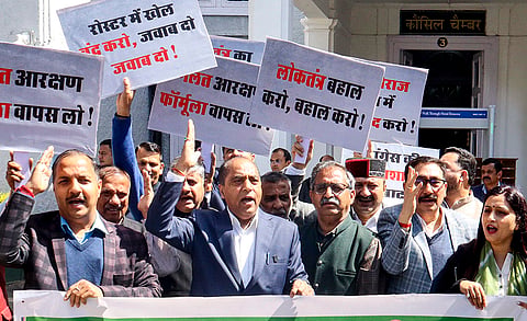 Himachal Pradesh LoP and BJP MLA Jairam Ram Thakur along with party MLAs stage a protest against the state government during the ongoing Budget Session of the state assembly, at the assembly premises, in Shimla.