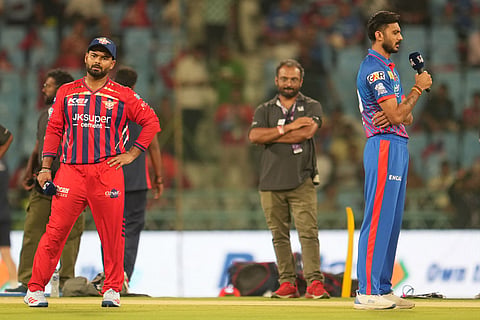 Delhi Capitals' captain Axar Patel, right, speaks as Lucknow Super Giants' captain Rishabh Pant, left, looks on after the toss ahead of the Indian Premier League cricket match between Lucknow Super Giants and Delhi Capitals in Lucknow, India.