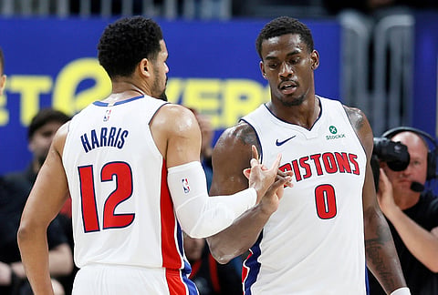 Detroit Pistons forward Tobias Harris (12) celebrates with center Jalen Duren (0) after a win over the Toronto Raptors in an NBA basketball game in Detroit. 