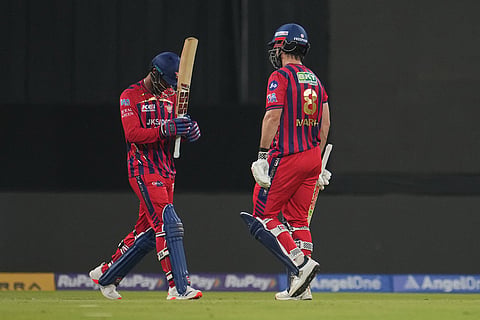 Lucknow Super Giants' Mitchell Marsh, right, walks off the field after losing his wicket as teammate Mukul Choudhary walks in to bat during the Indian Premier League cricket match between Lucknow Super Giants and Delhi Capitals in Lucknow, India.