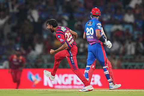 Lucknow Super Giants' Prince Yadav, left, celebrates the dismissal of Delhi Capitals' captain Axar Patel, right, during the Indian Premier League cricket match between Lucknow Super Giants and Delhi Capitals in Lucknow, India.