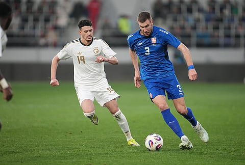 Serbia's Strahinja Pavlovic, right, and Saudi Arabia's Abdullah Alhamddan challenge for the ball during the international friendly soccer match between Serbia and Saudi Arabia in Backa Topola, Serbia.