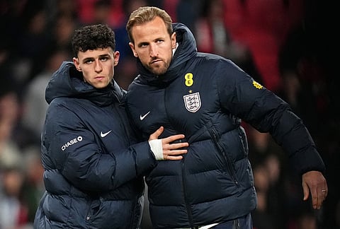 England's Phil Foden and Harry Kane reacts after their team lost the International friendly soccer match between England and Japan in London.