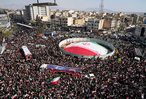 Mourners gather during a funeral procession for Alireza Tangsiri, head of Iran's Islamic Revolutionary Guard Corps Navy, and others killed in Israeli strikes in late March, in Tehran, Iran.
