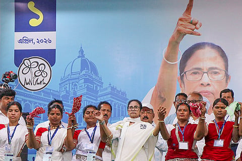 West Bengal Chief Minister Mamata Banerjee with tribal artists during a public rally in support of TMC candidate from Hasan constituency, Kajal Sheikh, ahead of the state Assembly elections, in  Birbhum.