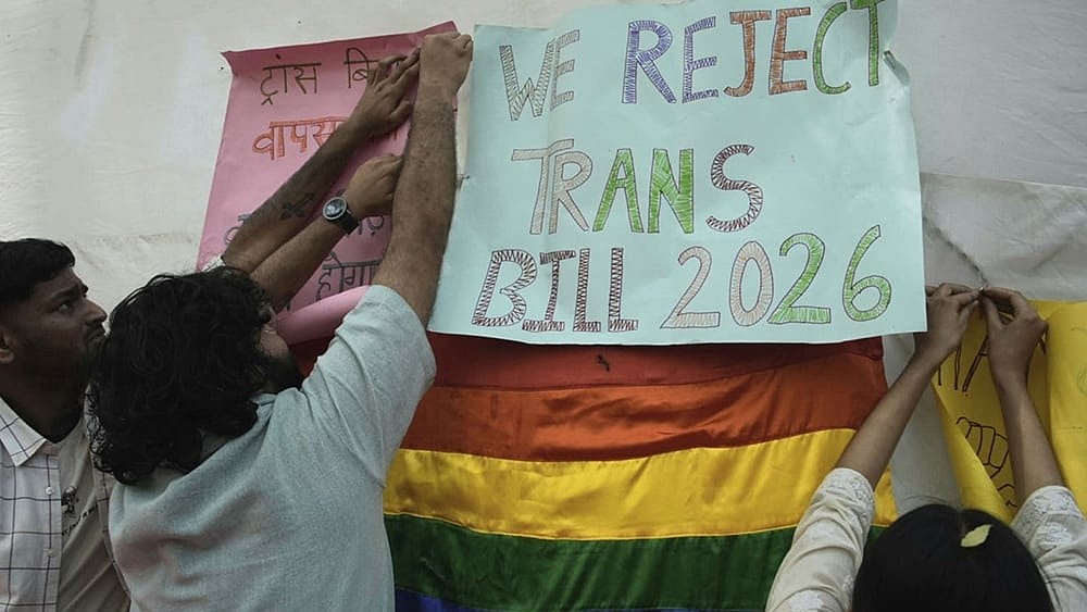 | Photo: Vikram Sharma/Outlook : Supporters of the LGBTQIA+ community hold placards during a protest against the passage of the Transgender Persons (Protection of Rights) Amendment Bill, 2026, at Jantar Mantar in New Delhi.