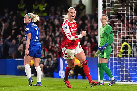 Arsenal's Stina Blackstenius celebrates scoring a goal before being ruled out via VAR for offside during the Women's Champions League quarterfinal second leg soccer match between Chelsea and Arsenal in London.