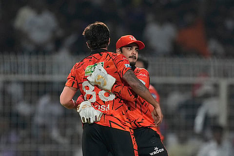 Sunrisers Hyderabad's captain Ishan Kishan, right, and Sunrisers Hyderabad's Nitish Kumar Reddy celebrates the wicket of Kolkata Knight Riders' Rinku Singh during the Indian Premier League cricket match between Kolkata Knight Riders and Sunrisers Hyderabad in Kolkata, India.