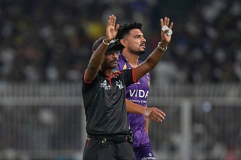 Kolkata Knight Riders' Vaibhav Arora, right, reacts as umpire signal six during the Indian Premier League cricket match between Kolkata Knight Riders and Sunrisers Hyderabad in Kolkata, India.