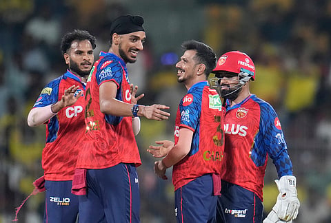Punjab Kings' Yuzvendra Chahal, second right, celebrates the wicket of Chennai Super Kings' captain Ruturaj Gaikwad with teammates during the Indian Premier League cricket match between Chennai Super Kings and Punjab Kings in Chennai.