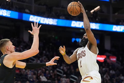 Cleveland Cavaliers guard James Harden (1) shoots against Golden State Warriors center Kristaps Porzingis during the second half of an NBA basketball game in San Francisco.