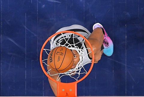 San Antonio Spurs forward Harrison Ingram watches the ball go in as the Spurs score during the second half of an NBA basketball game against the Los Angeles Clippers, in Inglewood, California.