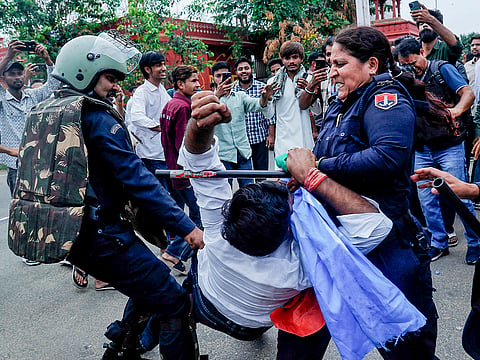 Police detain National Students' Union of India (NSUI) members during a protest over the proposed event organised by Rashtriya Swayamsevak Sangh (RSS) on the Rajasthan University campus, in Jaipur.