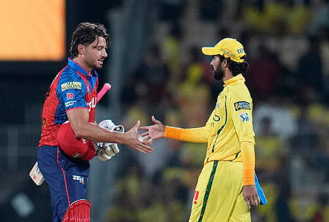 Punjab Kings' Marcus Stoinis shakes hand with Chennai Super Kings' captain Ruturaj Gaikwad after wining the Indian Premier League cricket against Chennai Super Kings and Punjab Kings in Chennai.