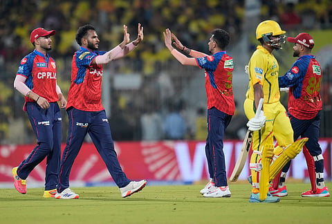 Punjab Kings' Vijaykumar Vyshak, second left, celebrates the wicket of Chennai Super Kings' Ayush Mhatre, second right, with teammates during the Indian Premier League cricket match between Chennai Super Kings and Punjab Kings in Chennai.