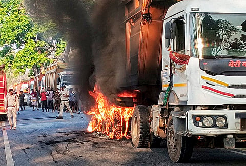Smoke billows during a fire in a truck, at Silli police station area, in Ranchi district, Jharkhand.