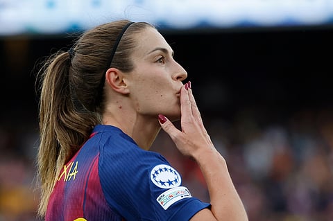 Barcelona's Alexia Putellas blows a kiss to supporters during a Champions League quarterfinal soccer match between Barcelona and Real Madrid, in Barcelona, Spain.
