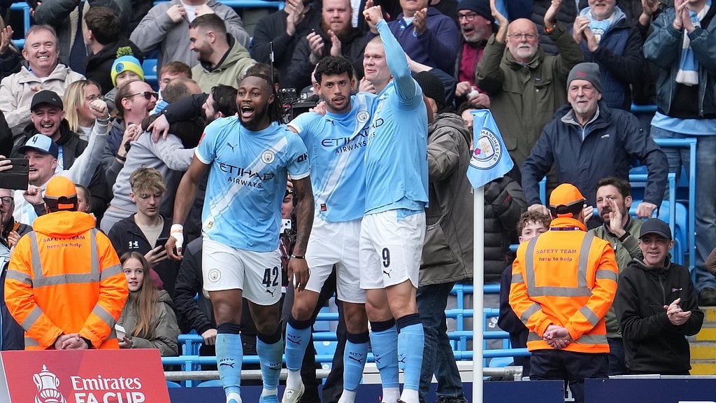 Manchester City players celebrate after a goal during the FA Cup quarter-final against Liverpool in Manchester. - AP