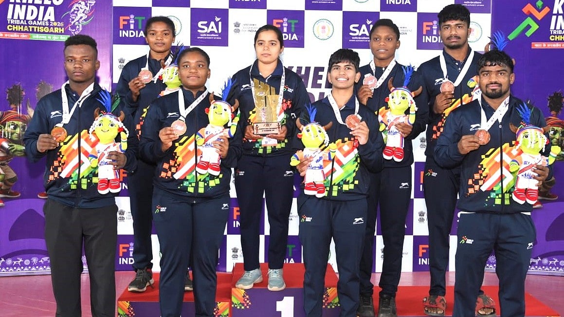 The Karnataka wrestling contingent poses with its medals at Khelo India Tribal Games 2026. - SAI Media