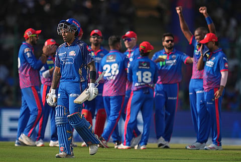 Mumbai Indians' Suryakumar Yadav leaves the ground after losing his wicket during the Indian Premier League cricket match between Delhi Capitals and Mumbai Indians in New Delhi.